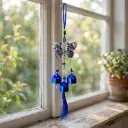 Colgante - Mariposa azul con campanitas (30x7cm)